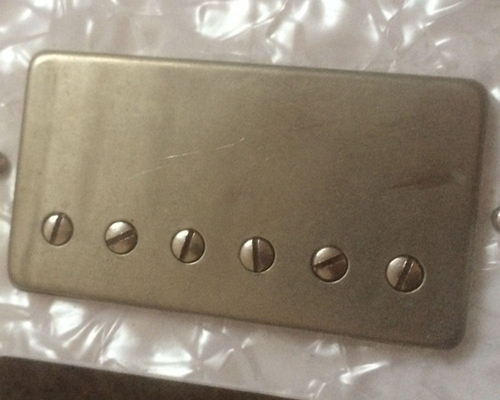 Unplated Humbucker cover after being played for a year