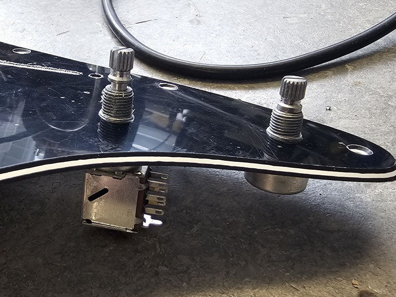 Alpha pots fitted to Stratocaster pickguard