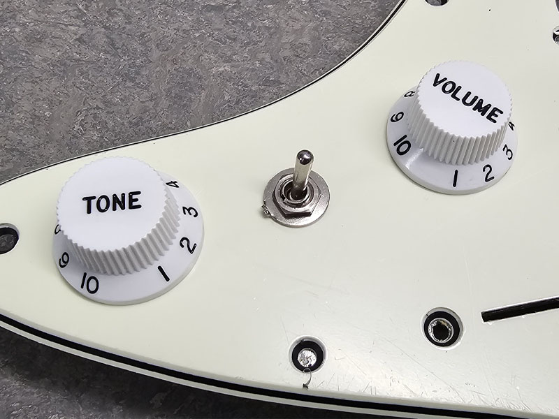 Mini Toggle Switch between Volume and Tone pot on Stratocaster