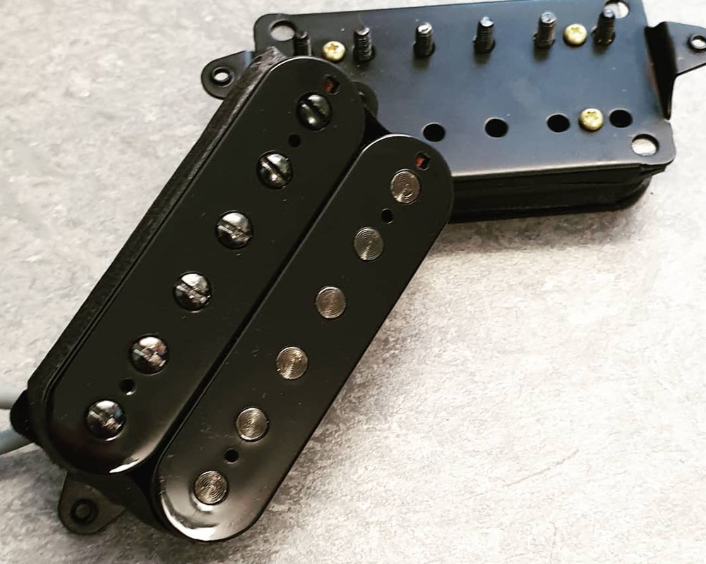 Uncovered Black humbucker with Black poles and Black triangle base